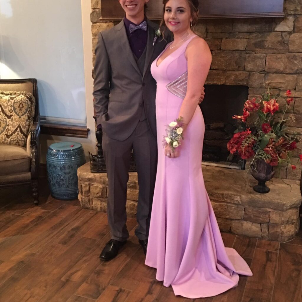 couple pink prom gown and black and grey tux